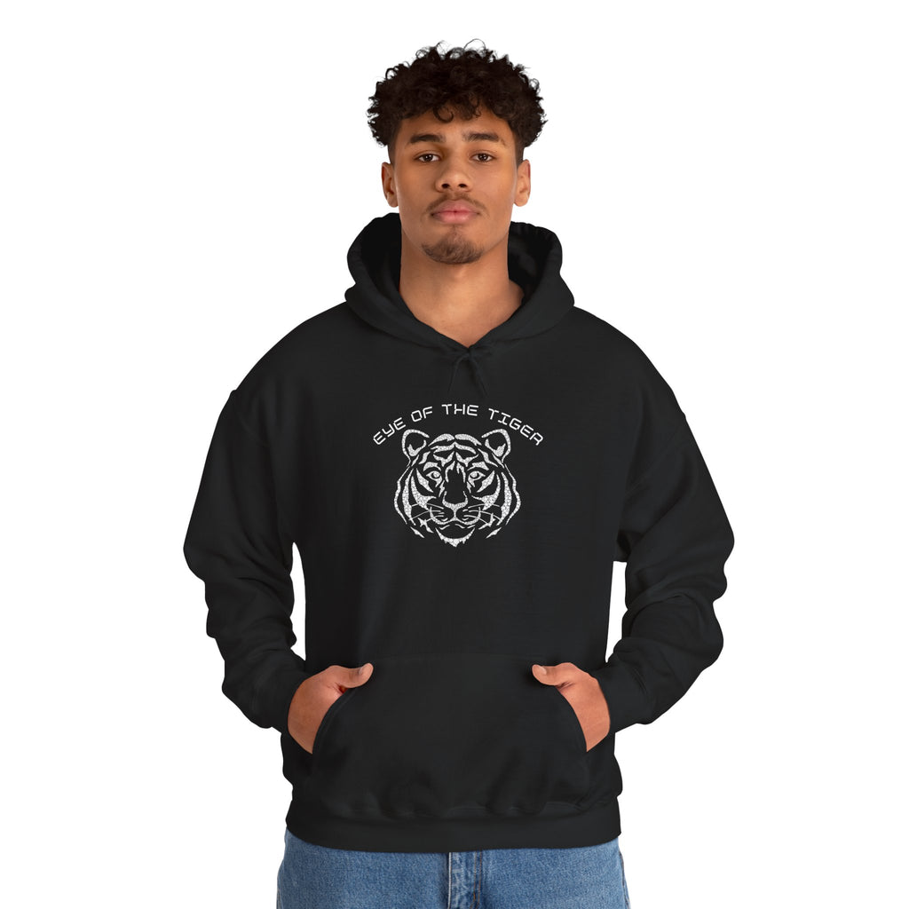 Person wearing a black hoodie with a tiger graphic and text on a white background
